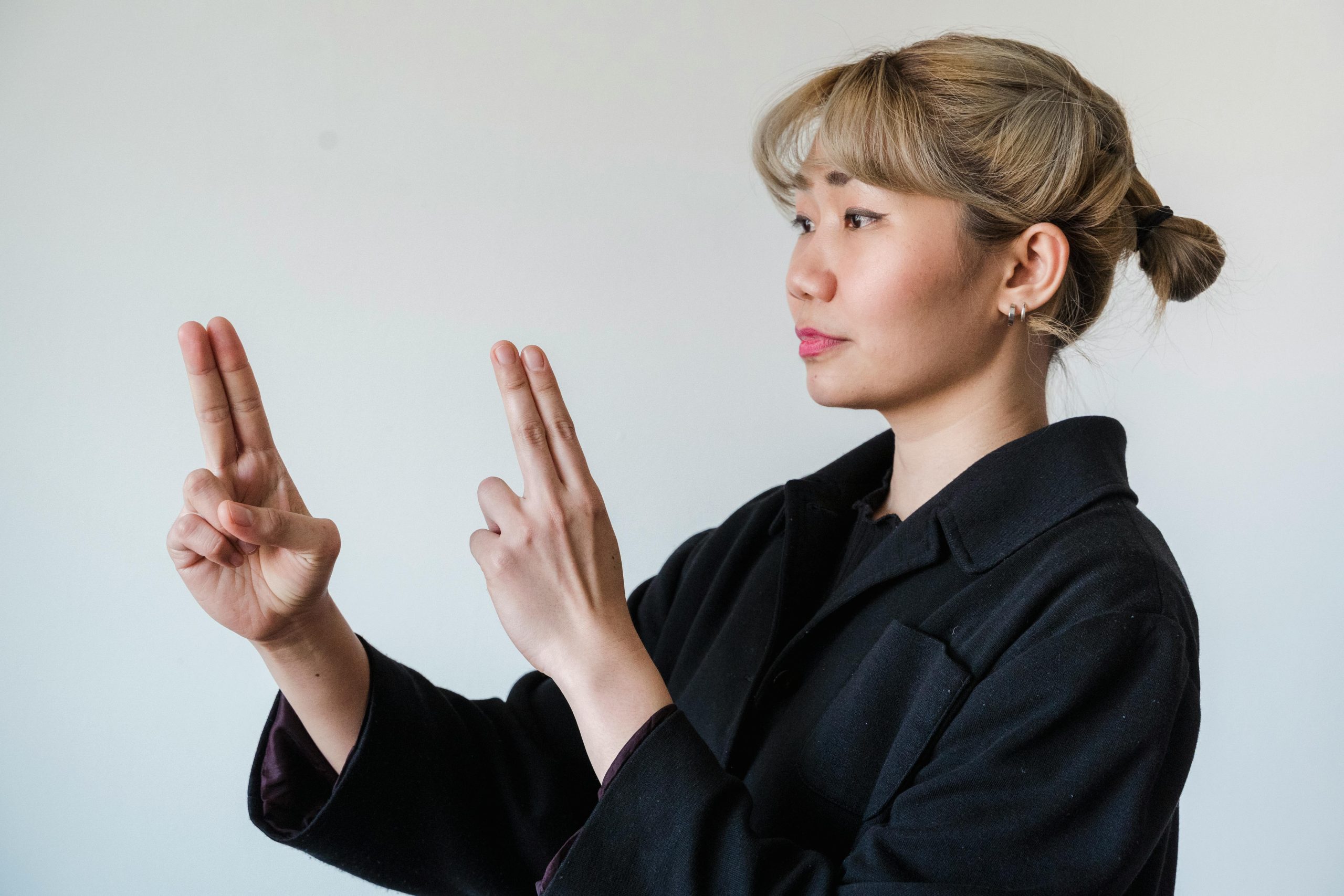 Person using visual aids and tools to manage NVLD challenges.