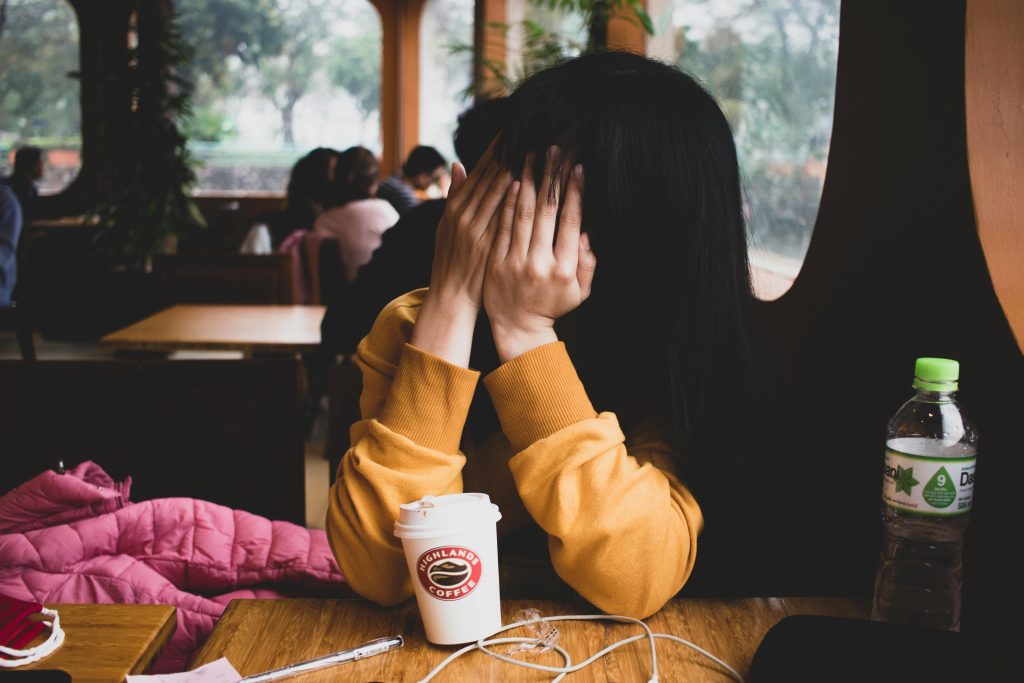 Woman covering her face