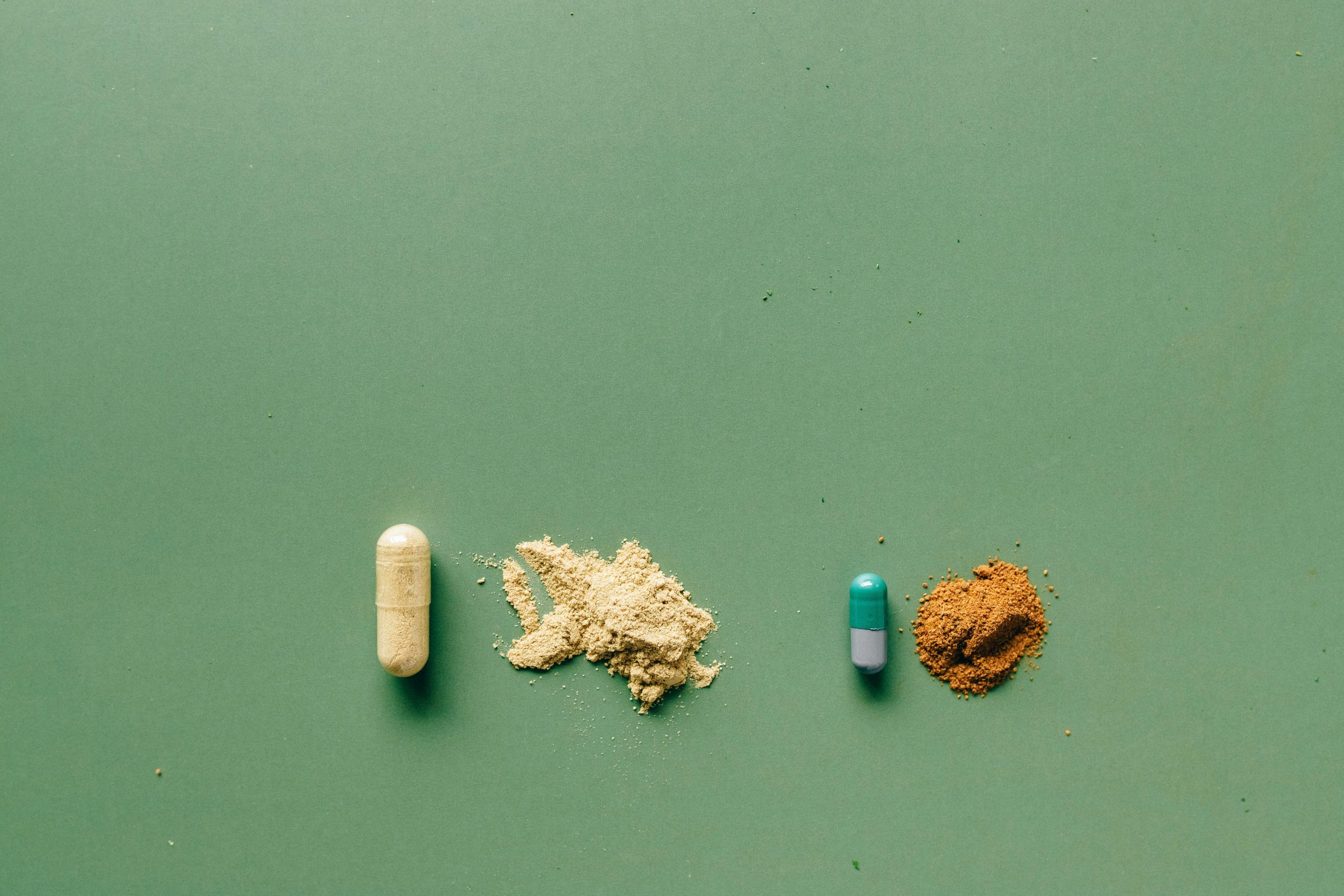Capsules on green background