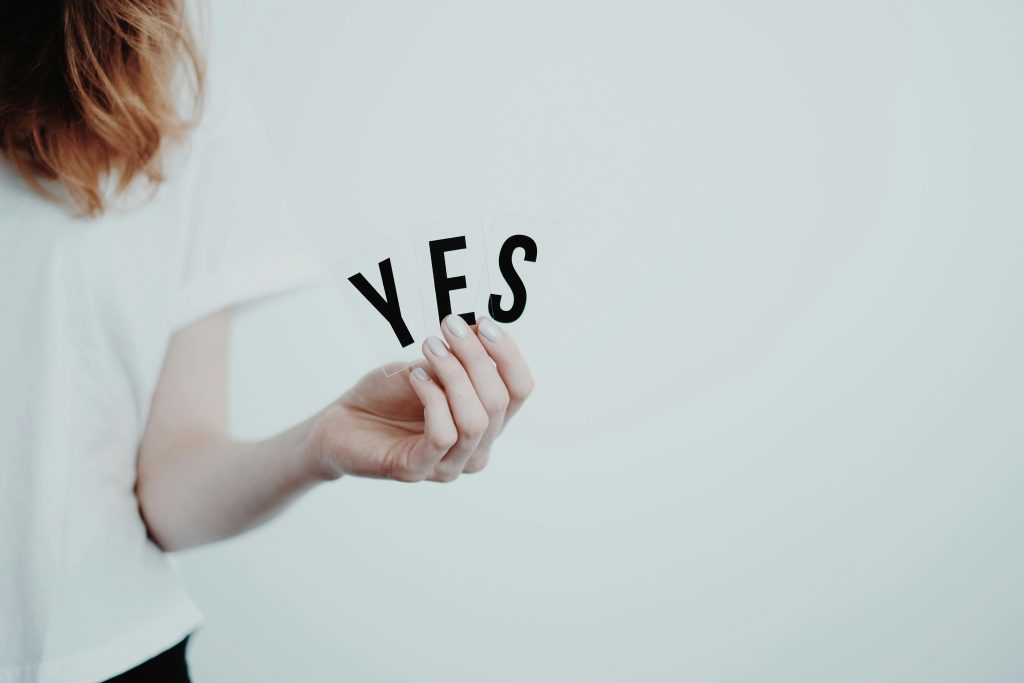 Woman holding a yes sign